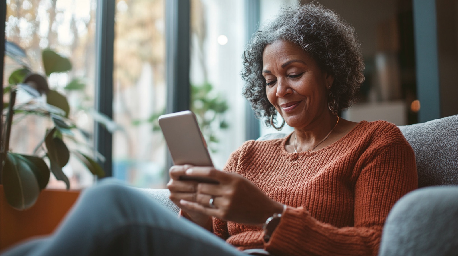 Woman reviewing health results on phone at home